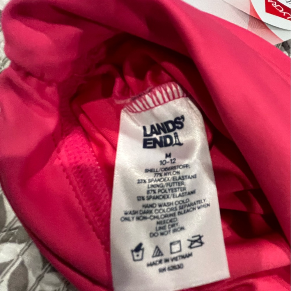 New pink swim bottoms. Waistband can be folded down or worn up. - Picture 2 of 4